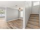 Inviting living room with wood-look floors and stairs to the upper level at 2802 Secret Canyon Rd, Las Vegas, NV 89074