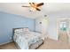 Relaxing main bedroom featuring a ceiling fan and access to an ensuite bathroom at 2802 Secret Canyon Rd, Las Vegas, NV 89074