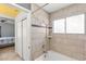 Tiled shower with a window and adjustable shower head at 2802 Secret Canyon Rd, Las Vegas, NV 89074
