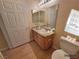 Cozy bathroom featuring a single sink vanity, a large mirror, and updated fixtures at 3318 N Decatur Blvd # 1059, Las Vegas, NV 89130