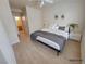 Light-filled bedroom with a neutral color palette, ensuite bathroom, and wood-look floors at 3318 N Decatur Blvd # 1059, Las Vegas, NV 89130