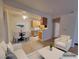 Open-concept floor plan with dining area leading to a spacious and welcoming living room at 3318 N Decatur Blvd # 1059, Las Vegas, NV 89130