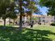 Park with picnic tables surrounded by mature shade trees and green grass at 3318 N Decatur Blvd # 1059, Las Vegas, NV 89130