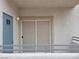 View from the patio showing the balcony railing and exterior wall with a door at 3318 N Decatur Blvd # 1059, Las Vegas, NV 89130
