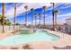 Community pool and jacuzzi area with lounge chairs and landscaped with palm trees at 3318 N Decatur Blvd # 1059, Las Vegas, NV 89130