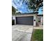 Two-car garage with landscaping in a residential neighborhood at 3436 Pino Cir, Las Vegas, NV 89121