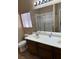 Bathroom featuring a dual sink vanity, walk-in shower, and ample lighting at 3917 White Castle St, Las Vegas, NV 89129