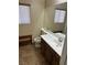 Bathroom with window and natural light, vanity with mirror and toilet at 3917 White Castle St, Las Vegas, NV 89129