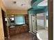 This primary bathroom features double sinks, a soaking tub, and a walk-in shower at 3917 White Castle St, Las Vegas, NV 89129