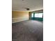 Spacious bedroom featuring neutral carpeting and chair rail, with ample natural light at 3917 White Castle St, Las Vegas, NV 89129