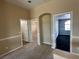 Spacious bedroom featuring neutral carpeting, and multiple open doorways for flexible living at 3917 White Castle St, Las Vegas, NV 89129