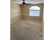 Bedroom featuring neutral carpeting, chair rail, natural light, and ceiling fan at 3917 White Castle St, Las Vegas, NV 89129