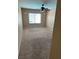 This bedroom includes neutral paint and carpet with a ceiling fan at 3917 White Castle St, Las Vegas, NV 89129