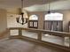 View of foyer featuring tall windows, a hanging light fixture, and living space with large windows at 3917 White Castle St, Las Vegas, NV 89129