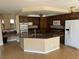 Open-concept kitchen featuring stainless steel appliances, granite countertops, and tile flooring at 3917 White Castle St, Las Vegas, NV 89129