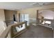 Second floor landing with neutral carpet and paint, with a view of the staircase and archway at 3917 White Castle St, Las Vegas, NV 89129