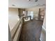Second floor landing with neutral carpet with a view of the staircase, archway, and doorways at 3917 White Castle St, Las Vegas, NV 89129