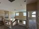 Second-floor landing with neutral carpet with a view of rooms with windows and open staircase at 3917 White Castle St, Las Vegas, NV 89129