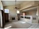 Large open-plan living room with neutral carpet, fireplace and tall ceilings at 3917 White Castle St, Las Vegas, NV 89129