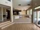 Spacious living room featuring tile floors, fireplace, and sliding doors to the outdoor patio at 3917 White Castle St, Las Vegas, NV 89129