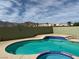 Sparkling backyard pool and spa with decorative tile and desert mountain views at 3917 White Castle St, Las Vegas, NV 89129