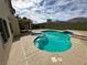 Private backyard swimming pool and spa, covered patio, and mountain views at 3917 White Castle St, Las Vegas, NV 89129