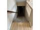 Carpeted staircase leads to a lower level with a door and natural lighting at 3917 White Castle St, Las Vegas, NV 89129