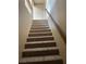 Carpeted staircase leads to an upper level with a handrail at 3917 White Castle St, Las Vegas, NV 89129