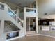 Open staircase design with glass railing details, with abundant natural light in a spacious foyer at 3917 White Castle St, Las Vegas, NV 89129