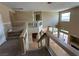 Carpeted staircase leading to the landing with views of the living area and backyard at 3917 White Castle St, Las Vegas, NV 89129