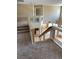 Staircase with neutral carpet leading up to the second floor landing, with views of the first floor at 3917 White Castle St, Las Vegas, NV 89129
