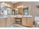 Bright bathroom with dual sinks, makeup vanity, and ample counter space at 4705 Bersaglio St, Las Vegas, NV 89135