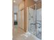 Accessible walk-in shower with safety features in a well-lit bathroom at 4705 Bersaglio St, Las Vegas, NV 89135