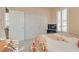Bright bedroom featuring plantation shutters, ample closet space and entertainment center at 4705 Bersaglio St, Las Vegas, NV 89135