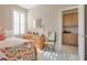 Comfortable bedroom with dresser, bright windows with plantation shutters and ensuite cabinets at 4705 Bersaglio St, Las Vegas, NV 89135