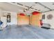 Spacious garage with built-in storage cabinets, providing ample space for vehicles and organization at 4705 Bersaglio St, Las Vegas, NV 89135