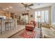 Open-concept living space showcasing a living room, breakfast bar, and adjacent dining area at 4705 Bersaglio St, Las Vegas, NV 89135