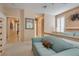 Bright primary bedroom with comfortable seating, shuttered windows, and neutral wall paint at 4705 Bersaglio St, Las Vegas, NV 89135