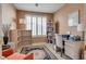 Comfortable home office with natural light, built-in shelving, and a dedicated workspace at 4705 Bersaglio St, Las Vegas, NV 89135
