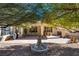 Inviting patio with mature trees, water feature, and outdoor seating area at 4705 Bersaglio St, Las Vegas, NV 89135