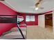 Bedroom showcases a bunk bed, window with blinds, ceiling fan and closet at 4756 Lake Pl, Las Vegas, NV 89147