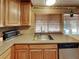 Well-equipped kitchen with stainless steel sink and modern appliances at 4756 Lake Pl, Las Vegas, NV 89147