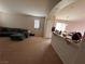 Comfortable living room featuring neutral walls, carpet and abundant natural light at 4841 Crystal Sword St, North Las Vegas, NV 89031