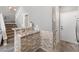 Stylish bar area with stone accents and a granite countertop near the staircase at 5945 Sunlight Garden Way, Las Vegas, NV 89118