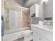 Bathroom featuring a tub and shower with a single sink vanity at 5945 Sunlight Garden Way, Las Vegas, NV 89118