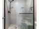 Modern bathroom with a glass enclosed shower and a built-in bench at 5945 Sunlight Garden Way, Las Vegas, NV 89118