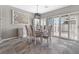 Elegant dining room with a modern chandelier and a full set of shutters at 5945 Sunlight Garden Way, Las Vegas, NV 89118