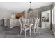 Elegant dining room featuring a neutral color scheme and views of the kitchen at 5945 Sunlight Garden Way, Las Vegas, NV 89118