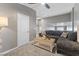 Loft area features a plush gray sectional sofa with gray walls and carpeted floors at 5945 Sunlight Garden Way, Las Vegas, NV 89118