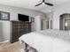 Main bedroom features a vaulted ceiling, large bed, and a spacious closet at 5945 Sunlight Garden Way, Las Vegas, NV 89118